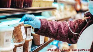 Woman choosing product in supermarket