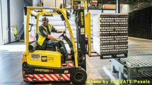 Man Riding on Yellow Forklift