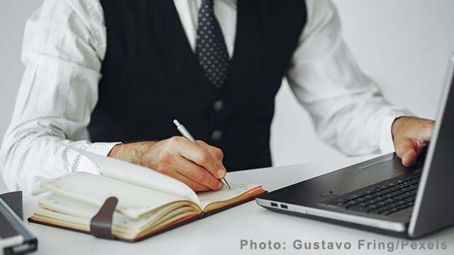 An Accountant Working at the Desk