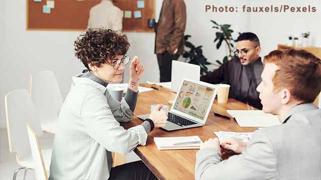 People sitting in conference room to discuss on sustainable marketing