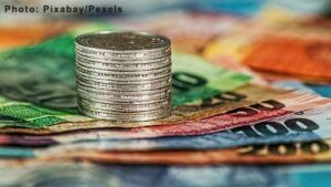 Assorted Banknotes and Round Silver-colored Coins